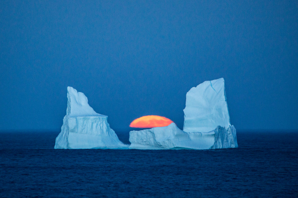 Full Moon Rising Between Two Iceberg Pillars.